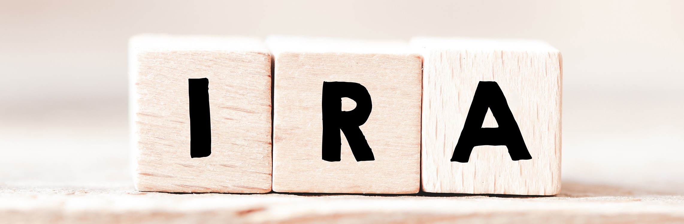 Wooden blocks spell 'IRA'