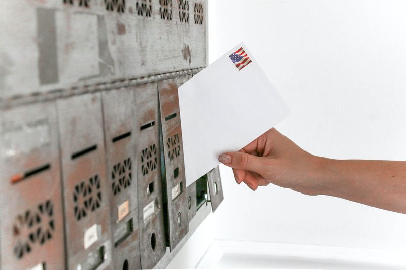 File:Person-holding-envelope-mail.jpeg