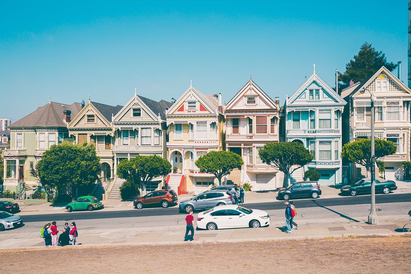 File:Homes along street with people.jpeg