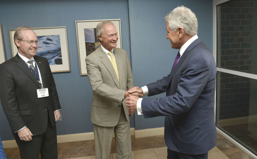 Rhode Island Gov. Lincoln D. Chafee, center, welcomes Secretary of Defense Chuck Hagel to a meeting of the Southeastern New England Defense Industry Alliance Sept 140903-D-NI589-125.jpg